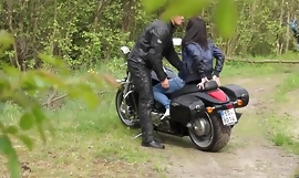 Muscled Biker Stretches Brunette's pussy outdoors