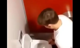 Spying guy arrhythmic off in public restroom