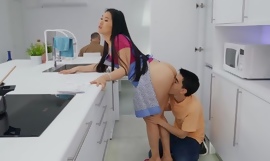 Asian hottie gets fucked right behind her husband's back